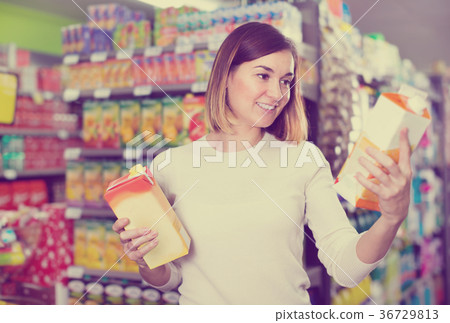 Girl customer looking for refreshing beverages Girl customer looking for refreshing beverages 36729813