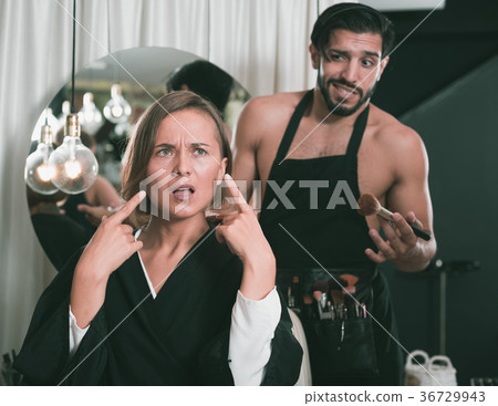 professional makeup artist with female shocked professional makeup artist with female shocked 36729943