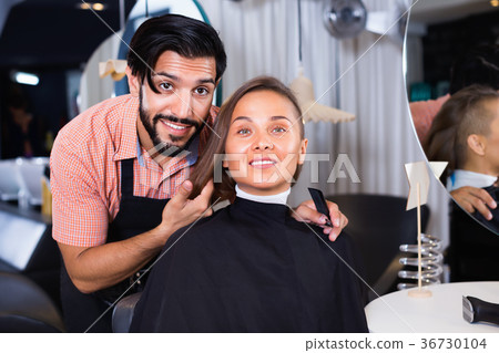 Male professional with female talking about hairstyle 36730104