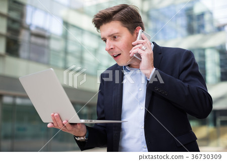 Portrait of businessman talking on the phone Portrait of businessman talking on the phone 36730309