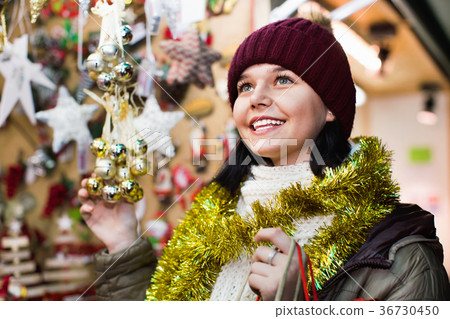 Teenage girl shopping at festive fair before Xmas Teenage girl shopping at festive fair before Xmas 36730450