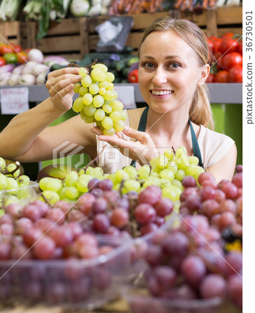 woman selling grapes at market . woman selling grapes at market . 36730501