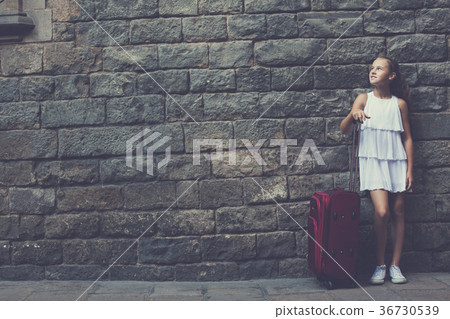 girl in white with travelling bag girl in white with travelling bag 36730539