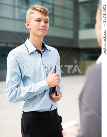 Businessman is talking with partner before signing contract Businessman is talking with partner before signing contract 36730601