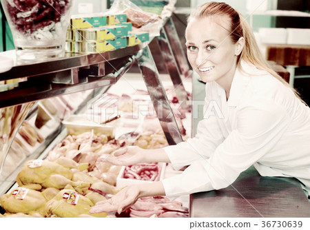 Female working in grocery in delicatessen section 36730639