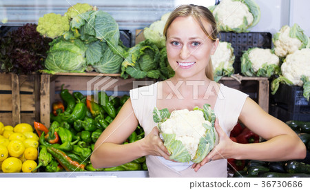 Customer choosing fresh cabbage 36730686