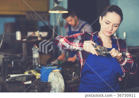 master is standing with adjustable wrench master is standing with adjustable wrench 36730911