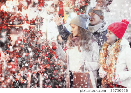 Family with teen girl choosing decoration Family with teen girl choosing decoration 36730926