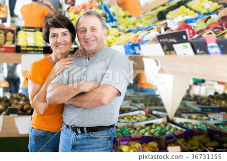 Happy mature couple who is standing in the fruit store 36731155