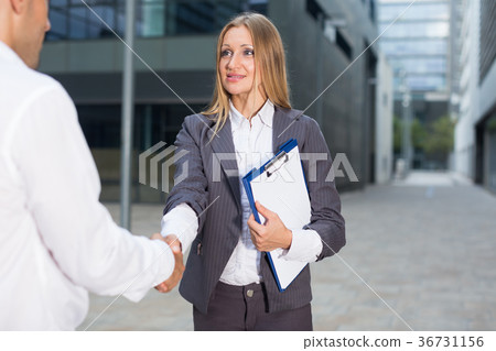 Female is talking with partner before signing contract 36731156