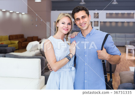 Young family is satisfied by buying new sofa Young family is satisfied by buying new sofa 36731335
