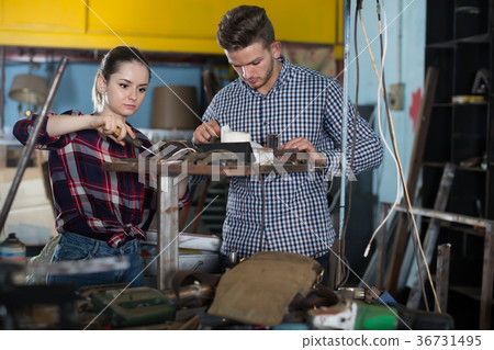 Two young masters are standing with tools Two young masters are standing with tools 36731495