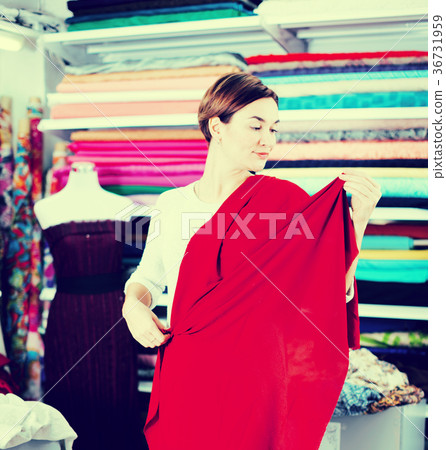 Woman testing fabric quality 36731959