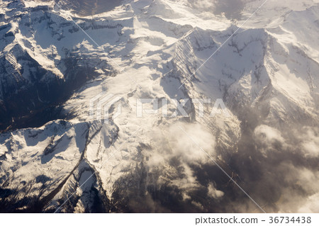 landscape with peaks covered by snow and clouds landscape with peaks covered by snow and clouds 36734438