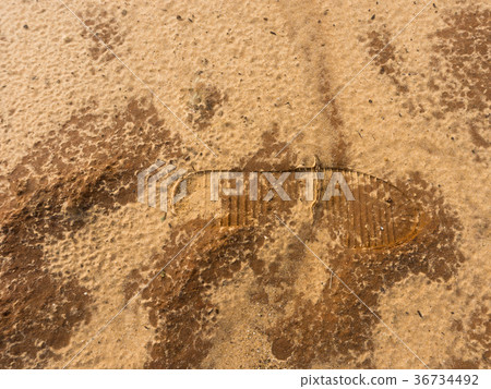 Human boot footprint on the sand. Concept mark in Human boot footprint on the sand. Concept mark in 36734492
