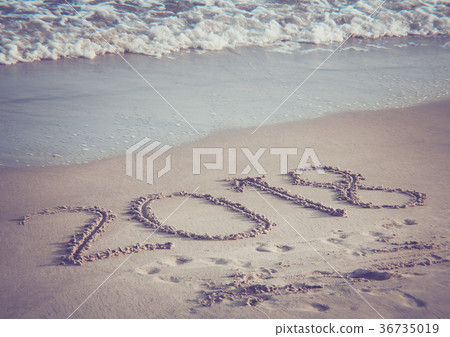 The number 2018 on the beach. The number 2018 on the beach. 36735019