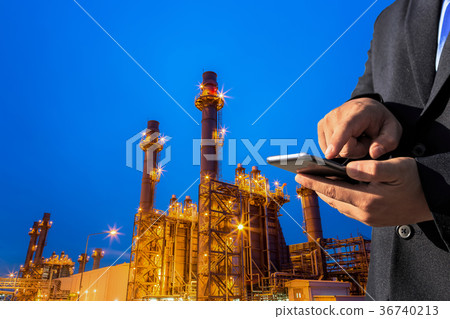 Businessman is use smartphone check factory Businessman is use smartphone check factory 36740213
