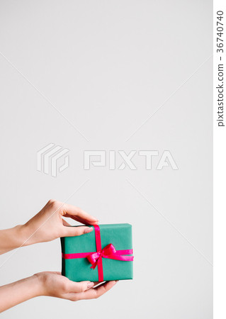 presenting an elegant gift on dark background 36740740