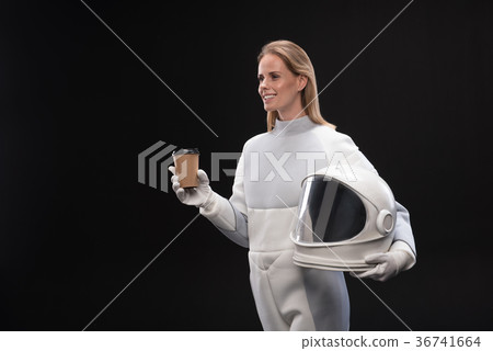 Optimistic elegant lady astronaut is enjoying 36741664