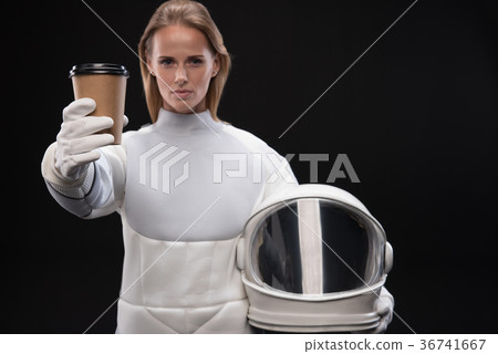 Severe spacewoman is demonstrating espresso 36741667
