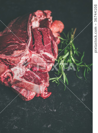 Raw beef meat t-bone steaks with rosemary, copy 36744108