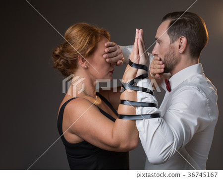 Husband and wife hands tied by tape 36745167