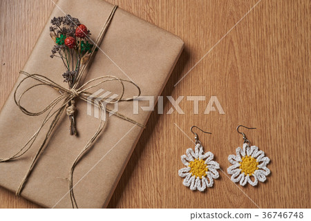 Wrapped book and earrings. Wrapped book and earrings. 36746748