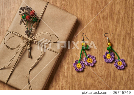 Wrapped book and earrings. Wrapped book and earrings. 36746749
