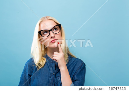 Young woman in a thoughtful pose 36747813