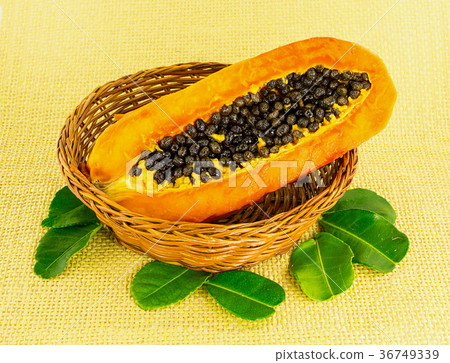 half yellow fruit ripe papaya with black round half yellow fruit ripe papaya with black round 36749339