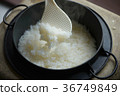 Cooked rice with a stove 36749849