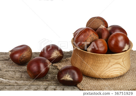 chestnut in bowl on the old wooden table with chestnut in bowl on the old wooden table with 36751929