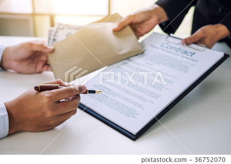 Bribery and corruption concept, bribe in the form of dollar bill 36752070