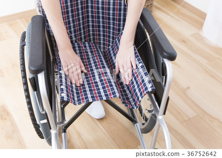 Caregiver preparing a wheelchair Body parts Parts cut Faceless Caregiver preparing a wheelchair Body parts Parts cut Faceless 36752642