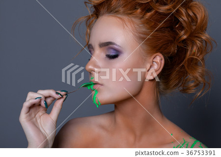 Creative portrait of a beautiful woman with red hair. Creative portrait of a beautiful woman with red hair. 36753391