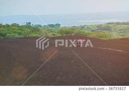 Man ride motorbike outside 36753817