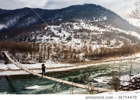 cold flow of river in snowy mountains 36754479