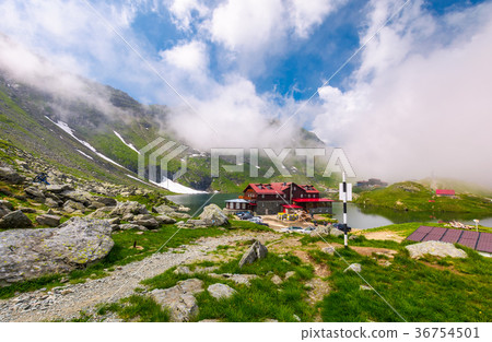 lake Balea in Fagaras mountains in foggy weather lake Balea in Fagaras mountains in foggy weather 36754501