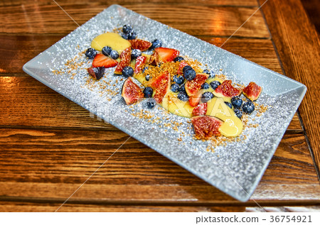 Cream Sabayon with forest, winter berries. Light 36754921