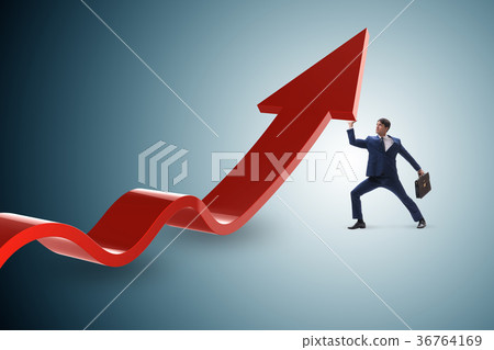 Businessman supporting growtn in economy on chart 36764169