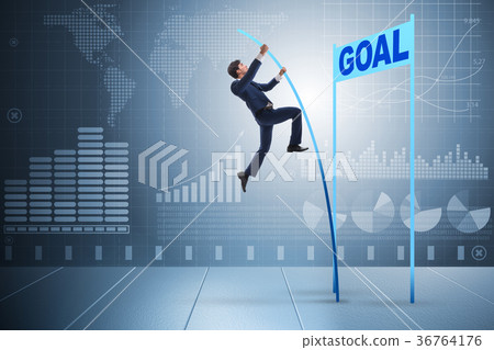 Businessman pole vaulting towards his goal in 36764176