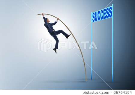 Businessman pole vaulting over towards his success 36764194