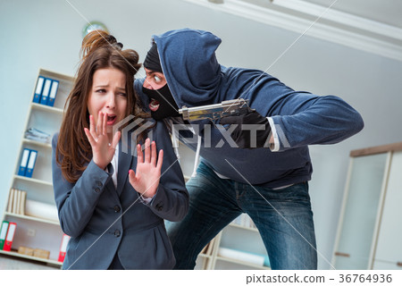 Criminal taking businesswoman as hostage in office 36764936