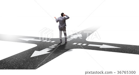 Young businessman at crossroads in uncertainty 36765300