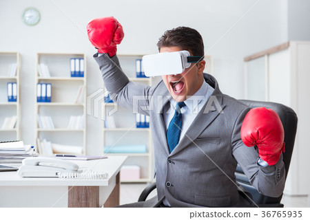 Man boxing in the office with virtual reality 36765935