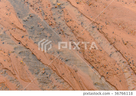 mud and stone in water as it flows away on road mud and stone in water as it flows away on road 36766118