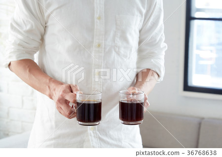 Male hand holding coffee 36768638