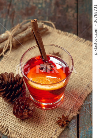 Christmas mulled wine on a rustic wooden table. 36769731
