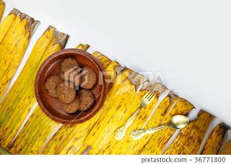 Cookies with coconut bowl on the banana leaves Cookies with coconut bowl on the banana leaves 36771800