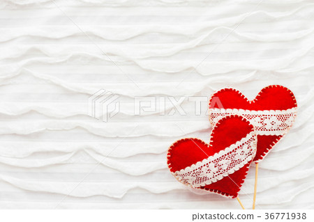 Two red felt hearts with laces, symbol of love Two red felt hearts with laces, symbol of love 36771938